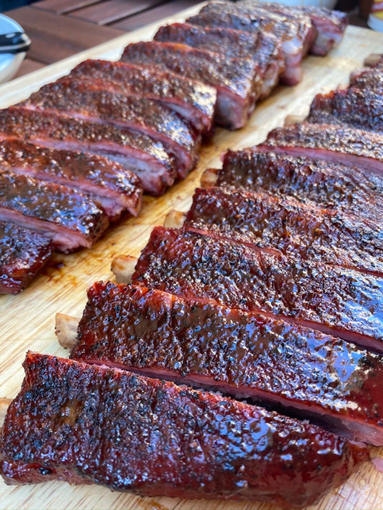 sliced st louis ribs on a cutting board