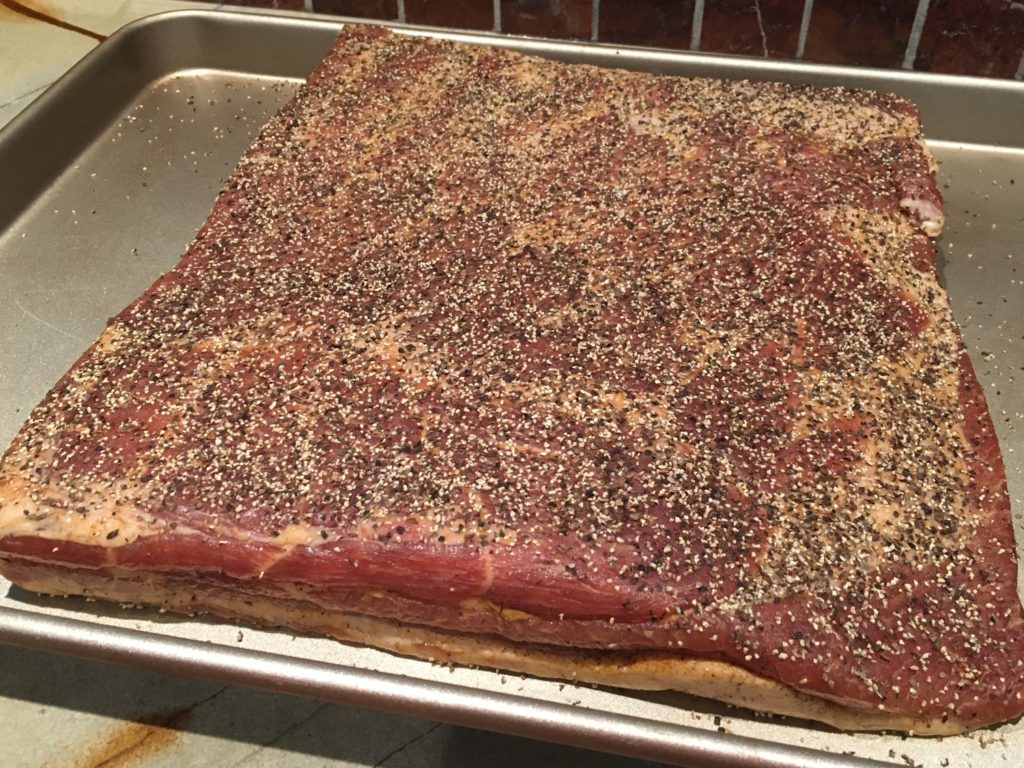 black pepper bacon before being smoked